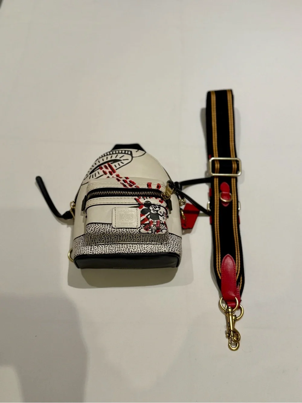 Coach & Disney mini backpack Red & Cream Keith hearing special edition.